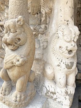 Ancient sandstone sculptures of Lion, Hindu Gods carved in the temple walls at the temple. Old paintings also seen in the walls