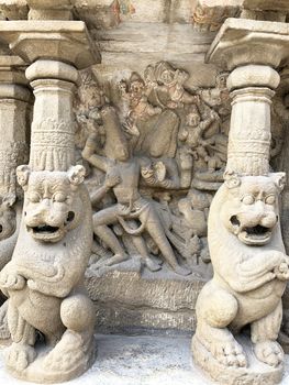 Ancient sandstone sculptures of Lion, Hindu Gods carved in the temple walls at the temple. Old paintings also seen in the walls