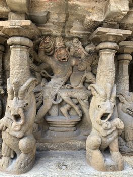 Ancient sandstone sculptures of Lion, Hindu Gods carved in the temple walls at the temple. Old paintings also seen in the walls