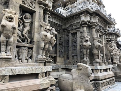Ancient sandstone sculptures of Lion, Hindu Gods carved in the temple walls at the temple. Old paintings also seen in the walls
