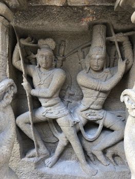 Ancient sandstone sculptures of Lion, Hindu Gods carved in the temple walls at the temple. Old paintings also seen in the walls