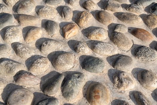 Old natural stone wall, background, texture or pattern. Rustic texture. Wall with bricks of italian stones.