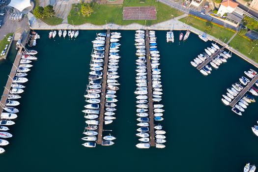 Aerial bird eye view of sailboats and yachts moored in Lovere port, Iseo lake near Bergamo,Italy.