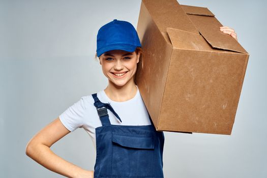 Woman in working uniform box packing service lifestyle. High quality photo