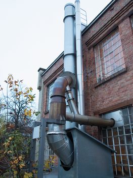  Old coffee-roasting establishment building with brick walls and chimney