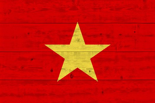 Vietnam flag painted on old wood plank. Patriotic background. National flag of Vietnam