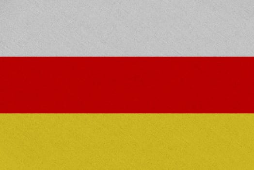 South ossetia fabric flag. Patriotic background. National flag of South ossetia