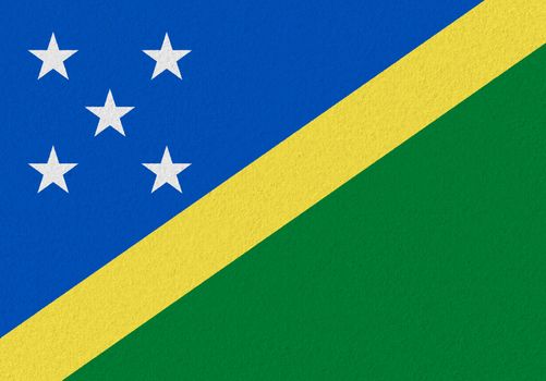 Solomon Islands paper flag. Patriotic background. National flag of Solomon Islands
