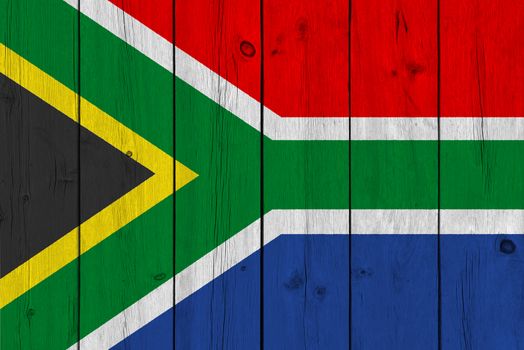 South Africa flag painted on old wood plank. Patriotic background. National flag of South Africa