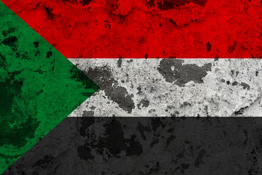 Sudan flag on old wall. Patriotic grunge background. National flag of Sudan