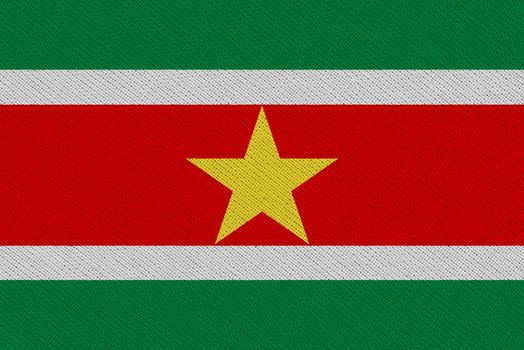 Suriname fabric flag. Patriotic background. National flag of Suriname