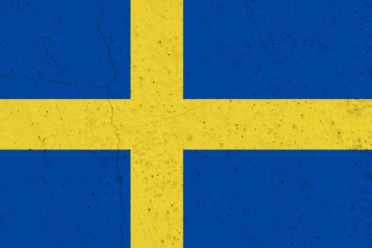 Sweden flag on concrete wall. Patriotic grunge background. National flag of Sweden