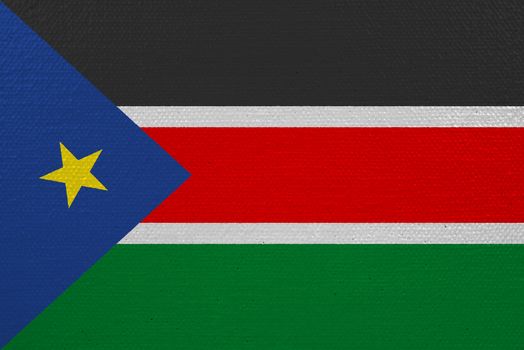 South Sudan flag on canvas. Patriotic background. National flag of South Sudan