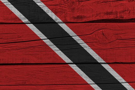 Trinidad and Tobago flag painted on old wood plank. Patriotic background. National flag of Trinidad and Tobago