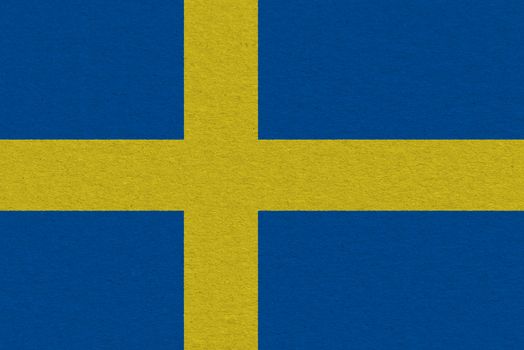 Sweden flag painted on paper. Patriotic background. National flag of Sweden