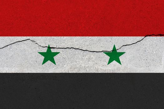 Syria flag on concrete wall with crack. Patriotic grunge background. National flag of Syria