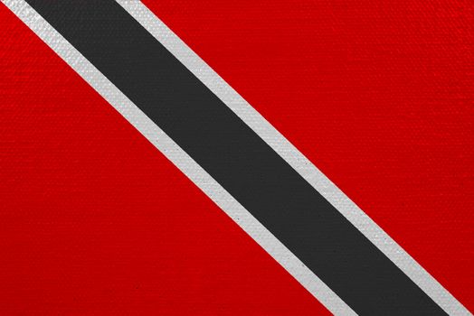 Trinidad and Tobago flag on canvas. Patriotic background. National flag of Trinidad and Tobago