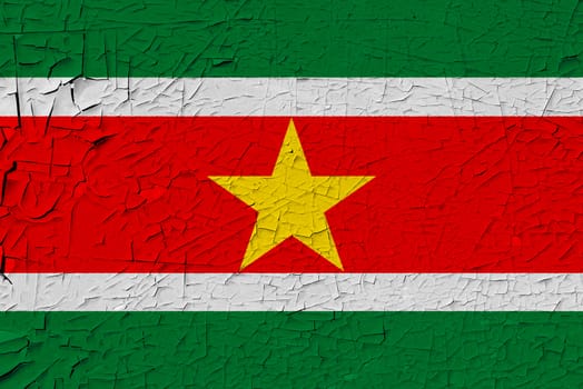 Suriname painted flag. Patriotic old grunge background. National flag of Suriname