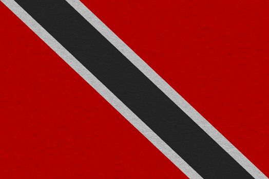 Trinidad and Tobago flag painted on paper. Patriotic background. National flag of Trinidad and Tobago
