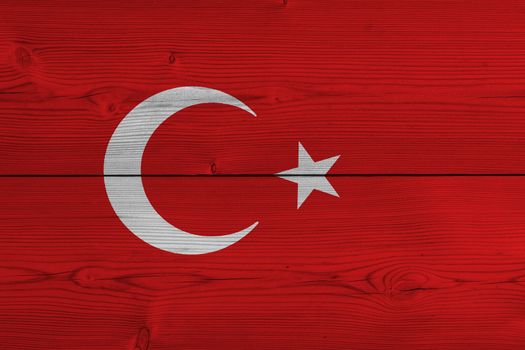 Turkey flag painted on old wood plank. Patriotic background. National flag of Turkey