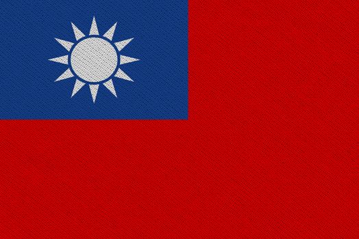 Taiwan fabric flag. Patriotic background. National flag of Taiwan