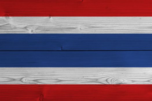 Thailand flag painted on old wood plank. Patriotic background. National flag of Thailand