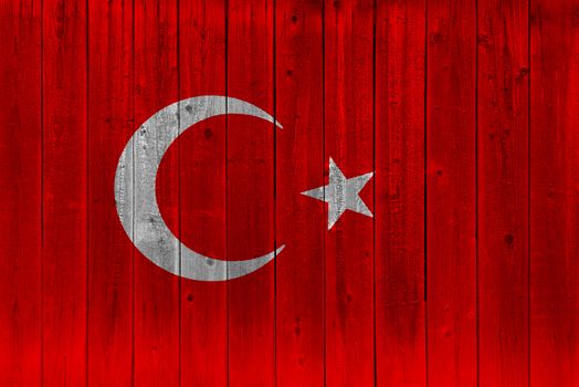 Turkey flag painted on old wood plank. Patriotic background. National flag of Turkey