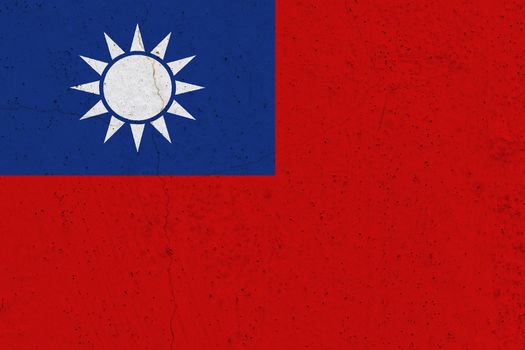 Taiwan flag on concrete wall. Patriotic grunge background. National flag of Taiwan