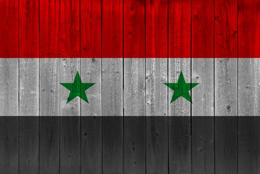 Syria flag painted on old wood plank. Patriotic background. National flag of Syria