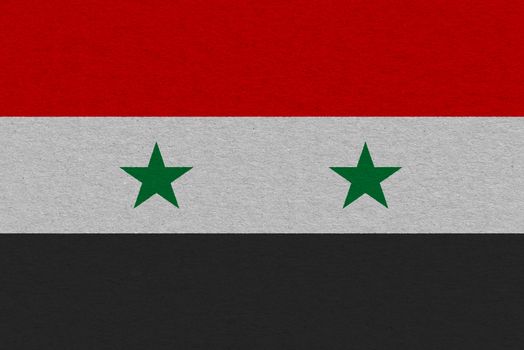Syria flag painted on paper. Patriotic background. National flag of Syria