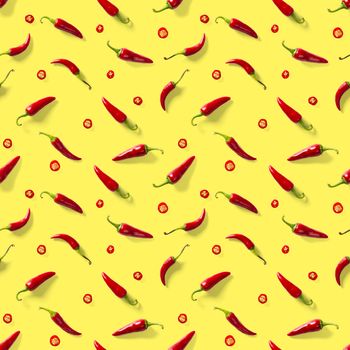 Red hot chilli seamless peppers pattern. Seamless pattern made of red chili or chilli on yellow background. Minimal food pattern. Food background.