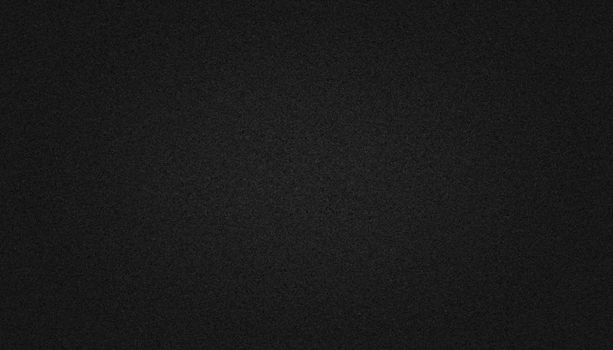 Black paper texture background with soft glowing backdrop, background texture for design
