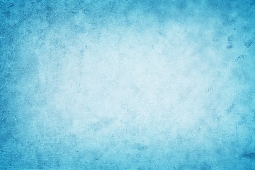 Blue background with grunge texture, blue sky soft with white center, texture for design
