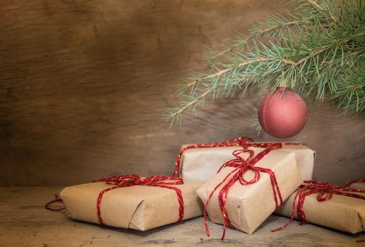 group of Christmas gifts on rustic wood