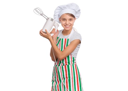 Teen girl in chef hat in apron with egg beater, isolated on white background.