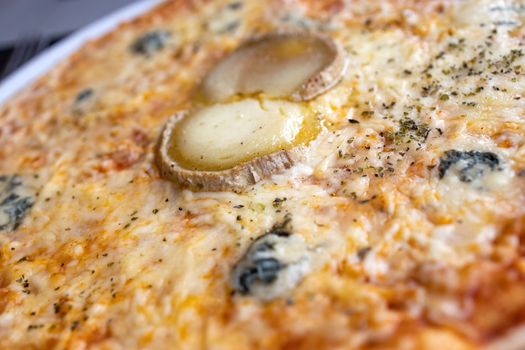 Close up of cheesy pizza in a Spanish restaurant