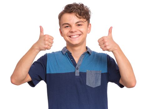 Cute teen boy pointing up, gesturing idea or doing number one gesture.