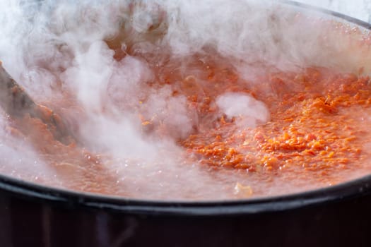 Cooking Ajvar made of tomatoes and paprika buy the old recepies