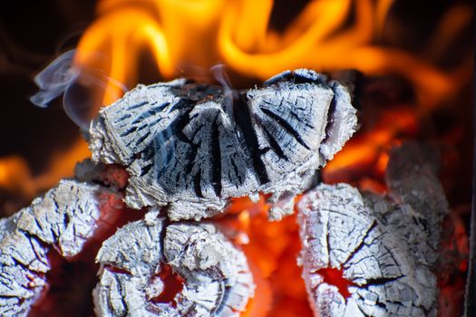 Close-up of fire in the old wooden stove. Wood logs in fire