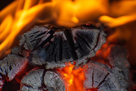 Close-up of fire in the old wooden stove. Wood logs in fire