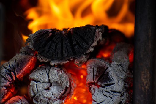 Close-up of fire in the old wooden stove. Wood logs in fire