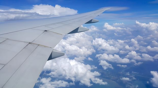 The view from the window of the plane while flying in the sky.