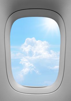 Closeup of the airplane window with the clouds sky background.