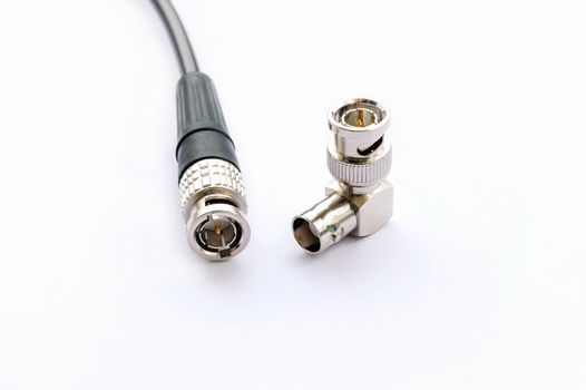 BNC connector jack with cable for video signal isolated on white background.