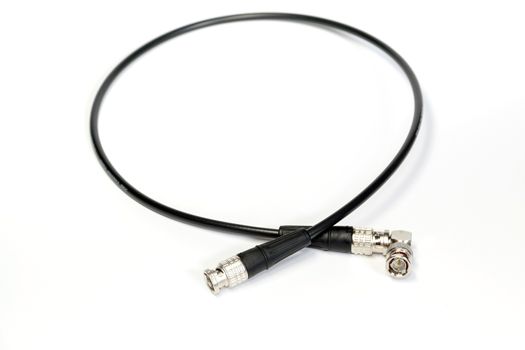 BNC connector jack with cable for video signal isolated on white background.