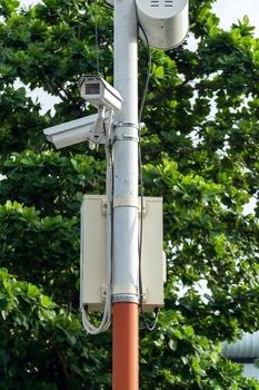 Closeup CCTV security camera at the entrance of the village.