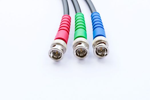 Closeup of BNC RGB color connector for video signal on white background.
