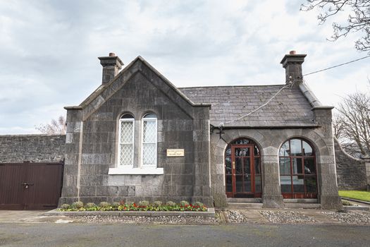 Dublin, Ireland - February 13, 2019: buildings in the cemetery at Arbor Hill next to the Church of the Sacred Heart on a winter day