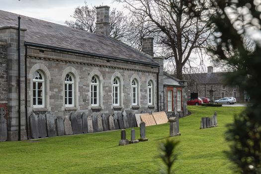 Dublin, Ireland - February 13, 2019: buildings in the cemetery at Arbor Hill next to the Church of the Sacred Heart on a winter day