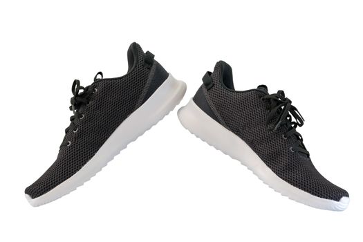 Black sneakers running shoes isolated on white background, with clipping path.